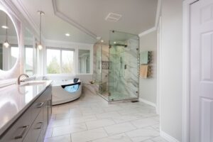 a modern, spacious bathroom with a walk in shower, large counter tops, and a luxury bath